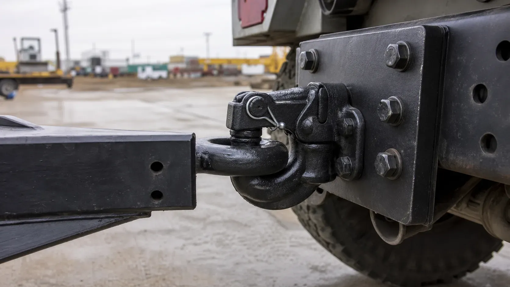 Lunette ring secured inside a frame-mounted pintle hook