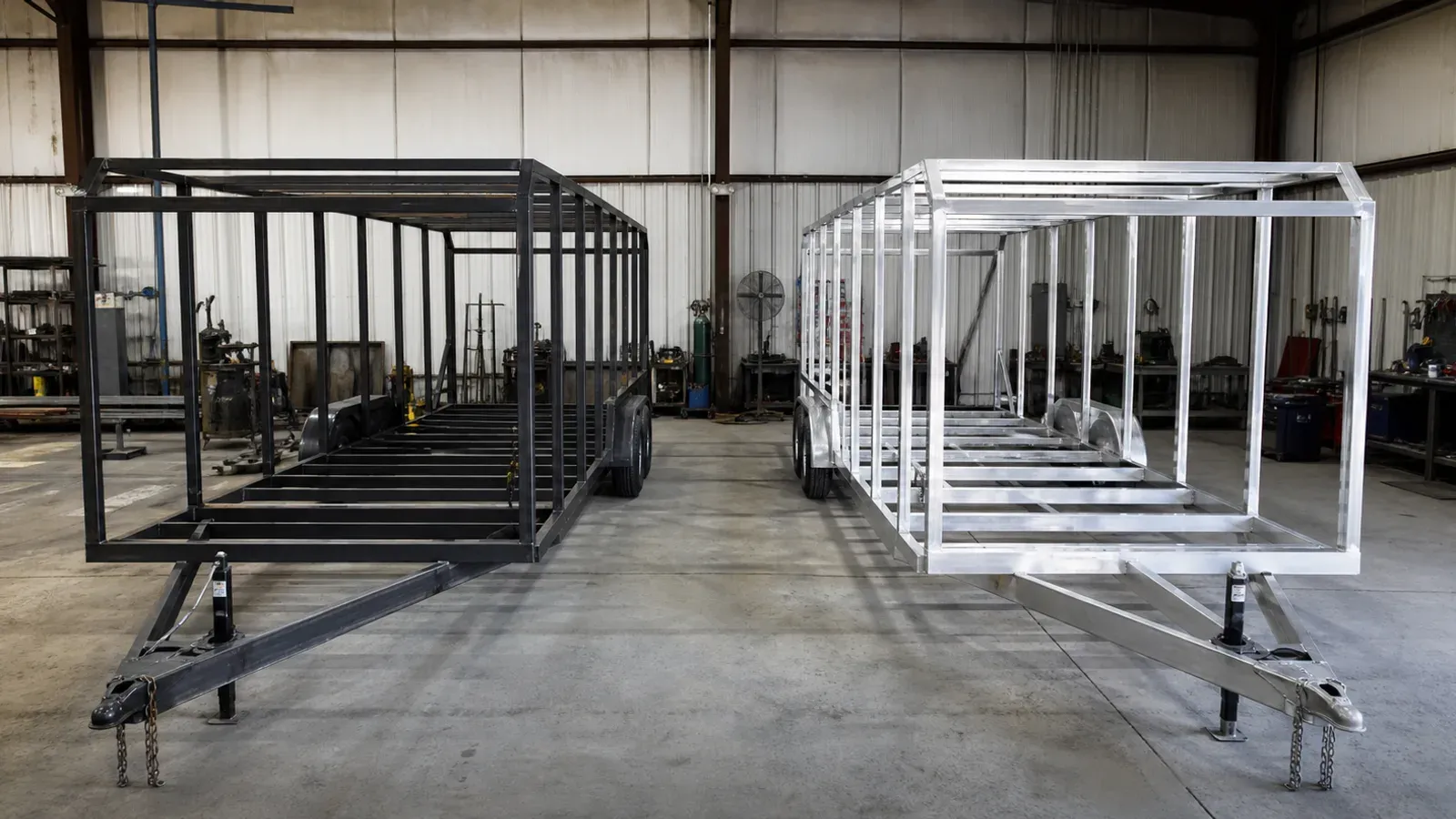 Steel and aluminum cargo trailer frames shown side by side