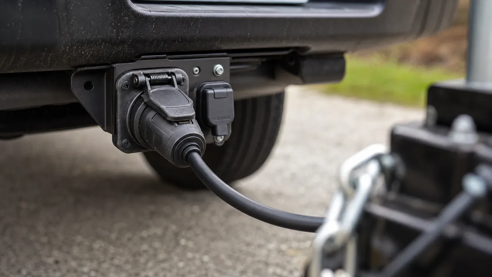 Seven-way trailer wiring plug connected to a pickup-mounted socket